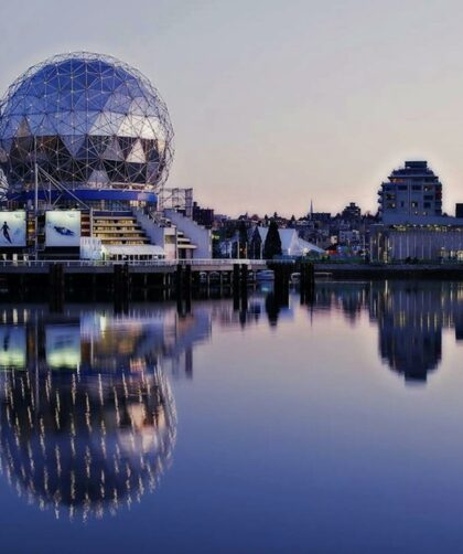 Grey Dome Building Beside Body of Water during Sunset