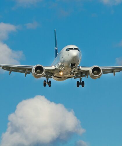 white airplane on mid air