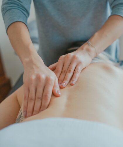 man massaging woman's body