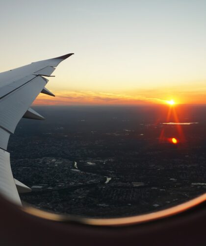 airplanes window view of sky during golden hour