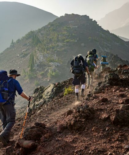 group of person walking in mountain