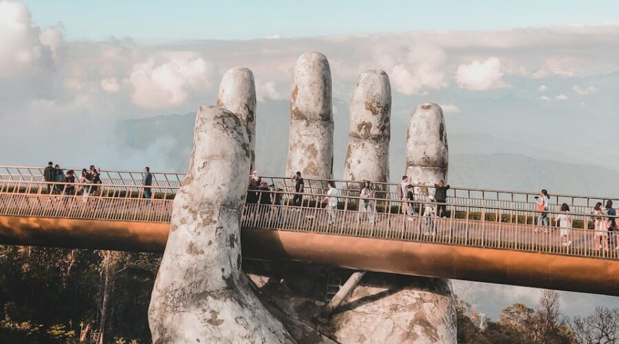 gray rock formation under white clouds during daytime